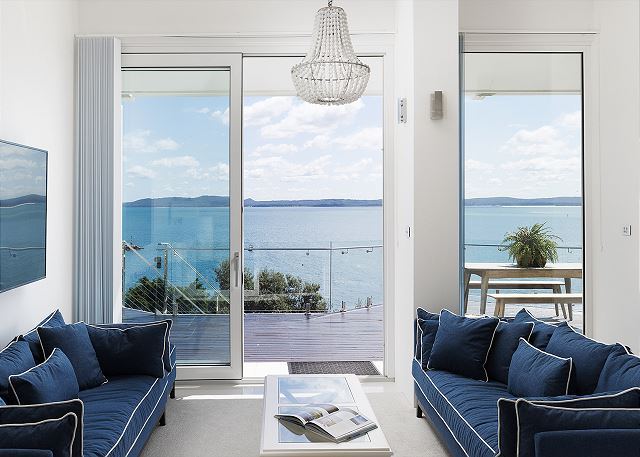 Living room sliding doors opening to the harbour view
