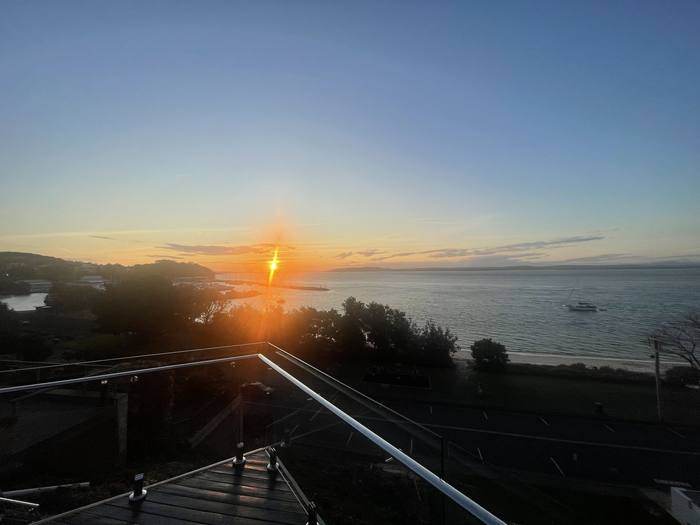 Sunset over Nelson Bay marina from Riviera's deck stairs
