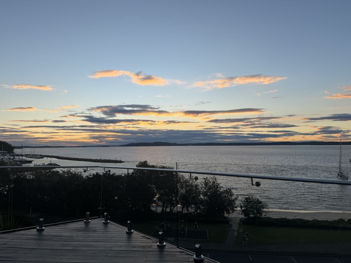 Dusk colours over Nelson Bay seen from Riviera's glass-balustrade deck